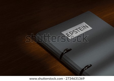 A file folder labeled EPSTEIN on a wooden desk. Investigations, court documents, hidden evidence, and public scandals related to high-profile legal cases concept.