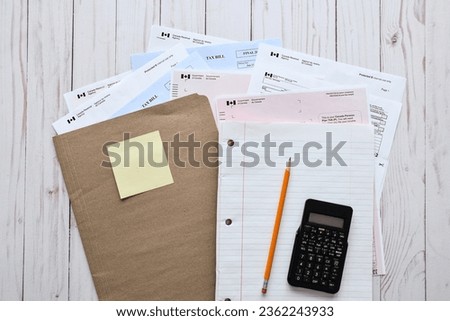File folder with paperwork to prepare annual taxes