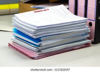 file folder and Stack of business report paper file on the table in a work office, concept document in work office