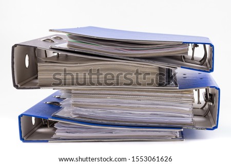 File folders or ring binders full with office documents isolated on white.