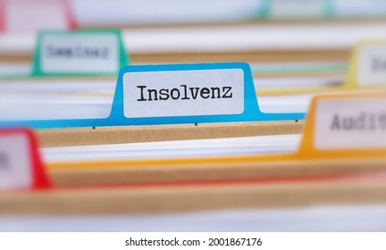 File folders with a tab labeled Insolvency in german - Insolvenz