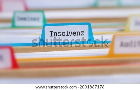 File folders with a tab labeled Insolvency in german - Insolvenz