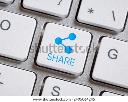 File or information sharing. Computer keyboard with share button.