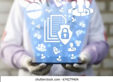 File Medical Data Security Safety Concept. Doctor Holds Tablet Computer With File Shield Lock Icon On Virtual Screen. Health Care Secure Computing Electronic Information Technology.