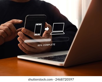 File transfer, data migration, transmission, backup files concept. Loading progress bar and smartphone sending to computer icons appear while person using mobile phone to sharing file with 2 devices.