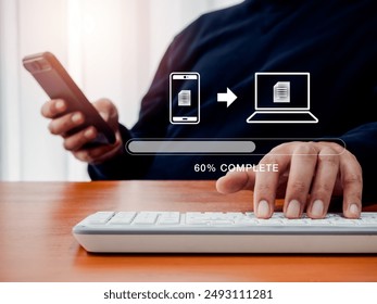 File transfer, data migration, transmission, backup files concept. Loading progress bar and smartphone sending to computer icons appear while office man using smartphone to transfer digital file data.