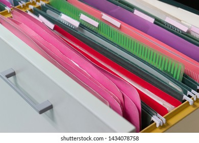 Files document of hanging file folders in a drawer in a whole pile of full papers, at work office, Business Concept Office document storage - Shutterstock ID 1434078758