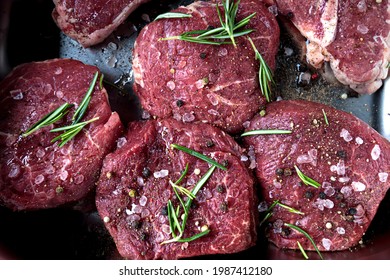 Filet Mignon Beaf Steak. Raw Butcher Meat Top View. Fresh Tenderloin Cut, Thick Barbeque Slab. Uncooked Beefsteak With Rosemary Spice Closeup, Grill Cooking Preparation