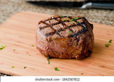 Filet Mignon. Grade A Grass Fed Angus Beef Steak. Tenderloin, Filet Mignon, New York Strip, Bone In Rib-eye Grilled Medium Rare On Outdoor Grill. Classic American Steakhouse Entree Favorite.