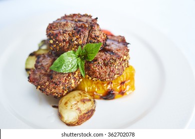 Filet Mignon With Grilled Vegetables On White Plate Studio Shot