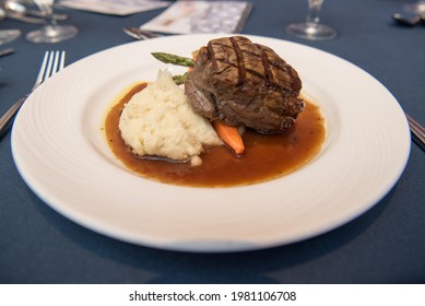 Filet Mignon With Mashed Potatoes And Vegetables On A White Plate. Overhead View