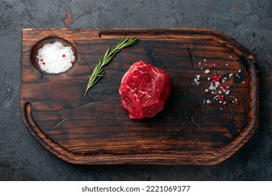 Filet Mignon Raw Beef Steak On A Wooden Background With Seasonings, Top View