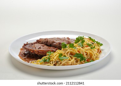 Filet Mignon With Spaghetti In Butter And Parsley.