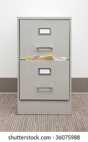 filing cabinet stuffed with papers