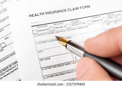 Filing health insurance claim form. Top view. - Shutterstock ID 1317379403
