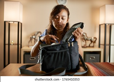 Filipina Nurse At Home Packing Lunch For Work