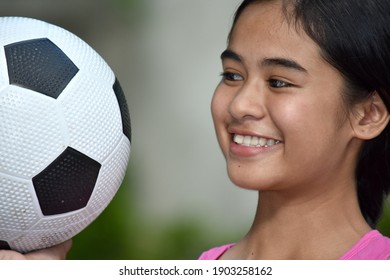 Filipina Teen Athlete Female Soccer Player Smiling With Soccer Ball