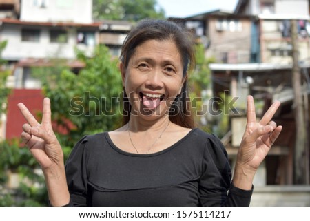 A Filipina Woman Making Funny Faces