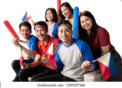 filipino group of people holding philippines flag celebrating independence day