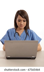 Filipino Nurse Doctor Working On Laptop Computer