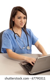 Filipino Nurse Doctor Working On Laptop Computer