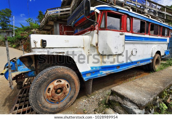 Filipino white-blue dyipni-jeepney\
car. Public transportation in Sagada town-originally made from\
US.military jeeps left over from WW.II locally altered-now from\
japanese surplus.\
Igorot-Philippines.