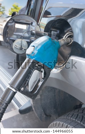 Fill up gas at a black car