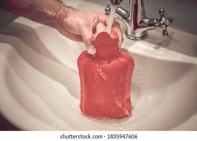 Fill A Hot Water Bottle With Warm Water Under The Tap