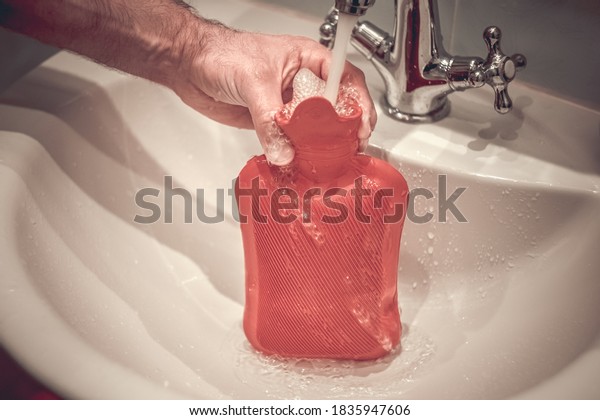 Fill a
hot water bottle with warm water under the
tap