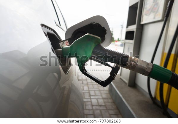 To fill the machine with fuel. fill with\
gasoline at a gas station. Gas station\
pump