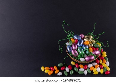 A Filled Easter Basket And Sweet Eggs