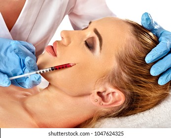 Filler Injection For Female Face. Plastic Aesthetic Facial Surgery And In Clinic. Beauty Woman Giving Injections In Cosmetology Room.