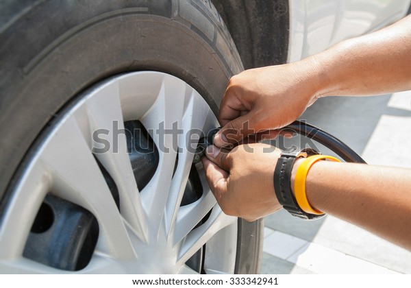 Filling air into a car
tire