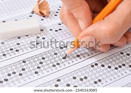 Filling answers of multiple choice examination close-up  