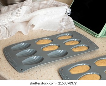 Filling Batter In Madeleine Pan, Selective Focus. Making Madeleine Cookies, Online Cooking Class. Mini French Cakes