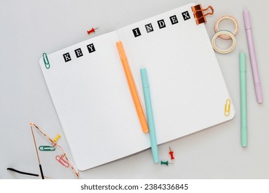 Filling in the diary, the inscription Key, Index in a dot notebook - Powered by Shutterstock