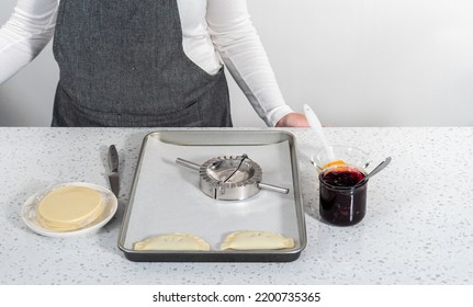 Filling Empanada Dough With Blueberry Pie Filling To Make Sweet Empanadas With Blueberries.