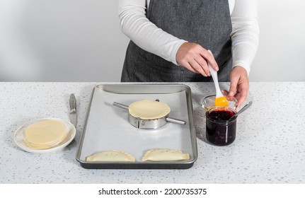 Filling Empanada Dough With Blueberry Pie Filling To Make Sweet Empanadas With Blueberries.