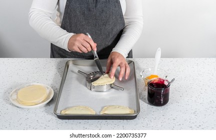 Filling Empanada Dough With Blueberry Pie Filling To Make Sweet Empanadas With Blueberries.