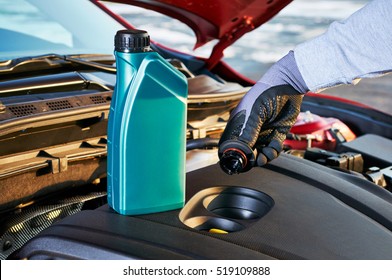 Filling Engine Oil In Modern Car. Winter Service For Safe Driving.