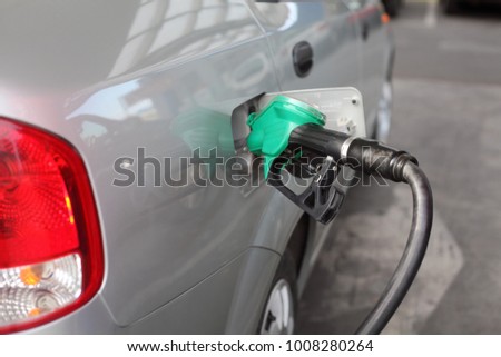 Filling up of  fuel at petrol station, closeup of equipment