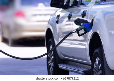 Filling gasoline in car with a nozzle.  - Shutterstock ID 689879212