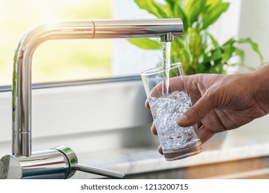 Filling Glass Of Water From Stainless Steel Kitchen Faucet