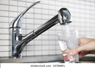 Filling Glass Of Water From Stainless Steel Kitchen Faucet