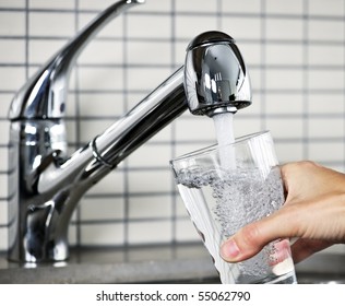 Filling Glass Of Water From Stainless Steel Kitchen Faucet