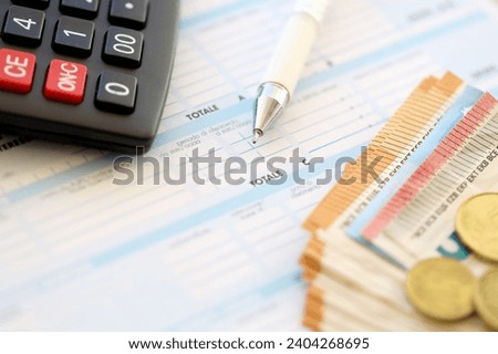 Filling italian tax form process with pen, calculator and euro money bills close up. Tax paying period and deadline Foto stock © 
