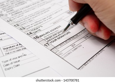 Filling in personal details on an application form - Shutterstock ID 143700781
