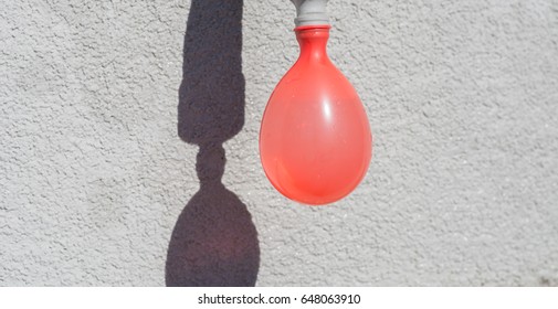 Filling Red Water Ballon With Water