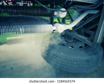 Filling Tanker Truck With Liquid Nitrogen. Cold Metal Pipe Smoking From Transferring Liquid Nitrogen