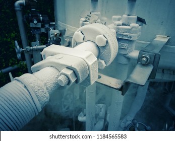 Filling Tanker Truck With Liquid Nitrogen. Cold Metal Pipe Smoking From Transferring Liquid Nitrogen